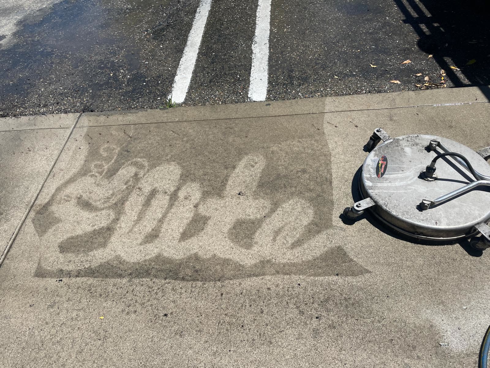 The Elite name pressure washed into concrete